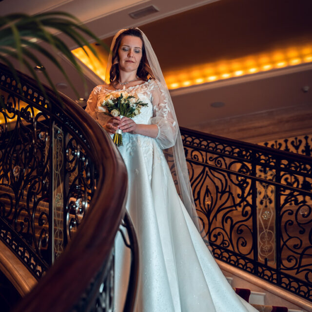 wedding-bride-flowers-stairs-white-dress