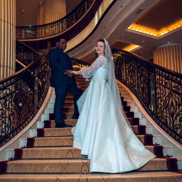 wedding-groom-bride-holding-hands-stairs