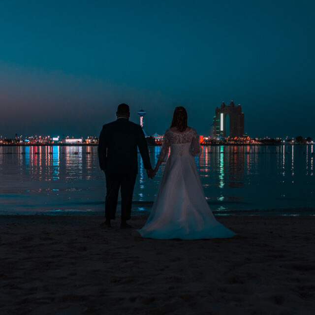 wedding-holding-hands-night-beach